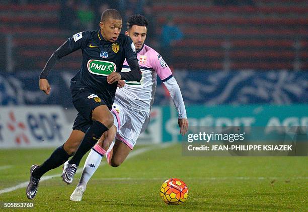 Monaco's French midfielder Kylian Lottin vies with Evian's French midfielder Killan Sanson during the French Cup football match between Evian and...