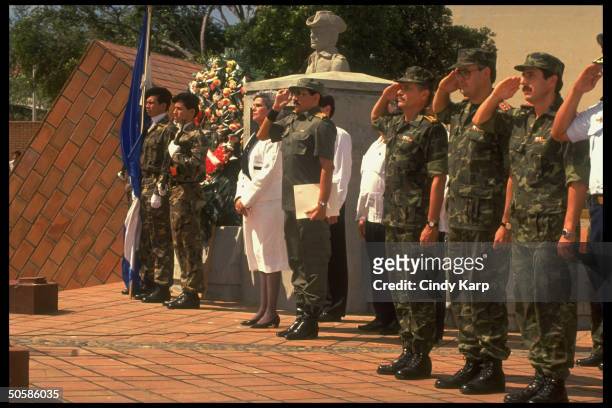 Pres. Violeta Barrios de Chamorro w. Saluting Def. Min. Gen. Humberto Ortega leading Army in pledging allegiance to her govt.