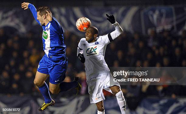 Concarneau's French midfielder Christophe Gourmelon vies with Troyes' French defender Anele Calvin Ngcongca during the French Cup football match...
