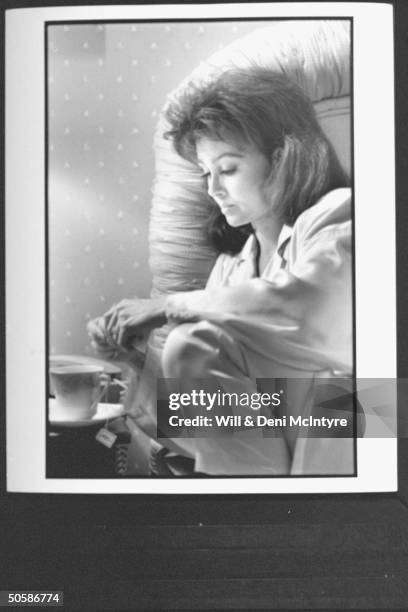 Naomi Judd, mother of mother-daughter C/W duo, making tea in bed, suffering from chronic hepatitis.in condo nr Nashville.