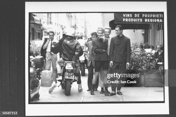 Fashion designer Jean-Paul Gaultier w. Models showing off his designs, incl. Male in double-breasted suit w. Long polka dot shorts worn over the...