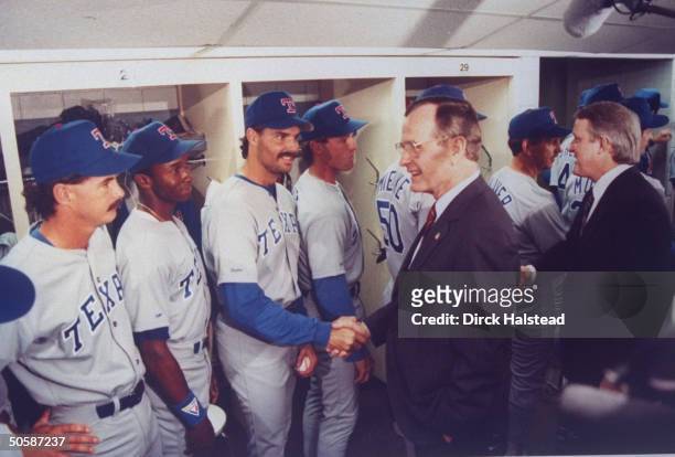 Pres. Bush & his host PM Brian Mulroney shaking hands w. Visiting TX Rangers baseball team players.; 1990.