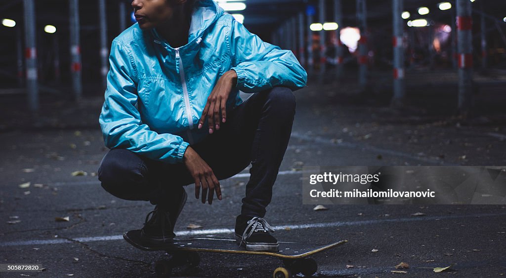 Girl posing on skateboard