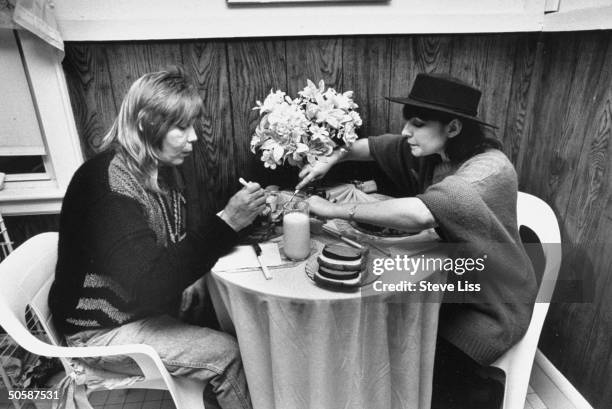 Homeless derelict Christopher Dickinson who impersonated drummer Peter Criss in an attempt to obtain benefactors, having lunch w. So-called Criss...