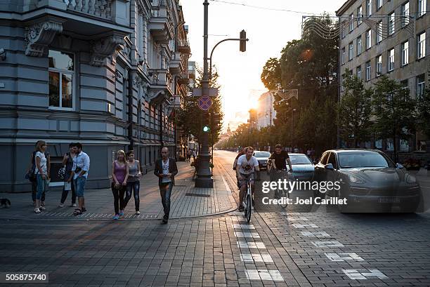 people, bicycles, and cars - vilnius, lithuania - vilnius bildbanksfoton och bilder