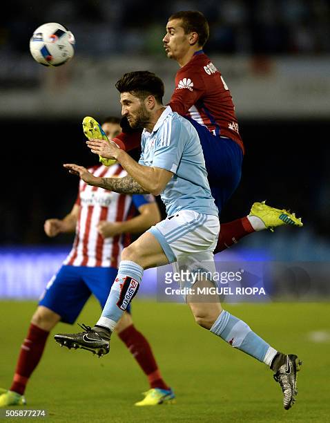 Celta Vigo's defender Carles Planas vies with Atletico Madrid's French forward Antoine Griezmann during the Spanish Copa del Rey football match Celta...