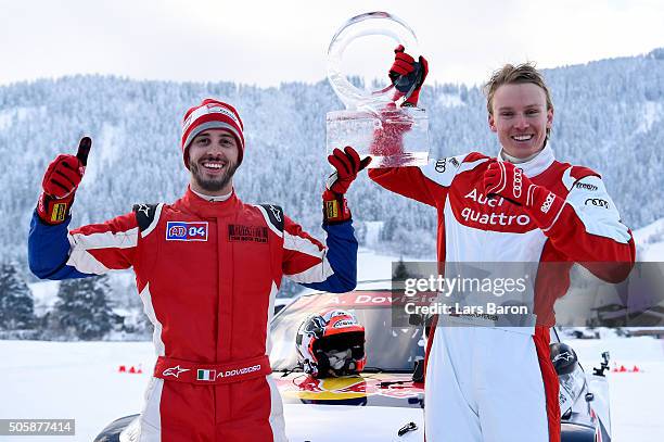 The winning team Andrea Dovizioso and Henrik Kristoffersen pose with the trophy after the final day of the Audi Quattro #SuperQ on January 20, 2016...