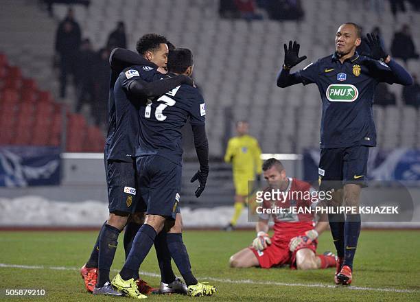 Monaco's Portuguese midfielder Helder Costa celebrates with teammates after scoring a goal during the French Cup football match between Evian and...