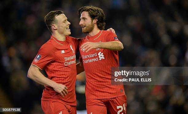 Liverpool's Welsh midfielder Joe Allen celebrates with Liverpool's Australian defender Brad Smith after scoring the opening goal of the English FA...