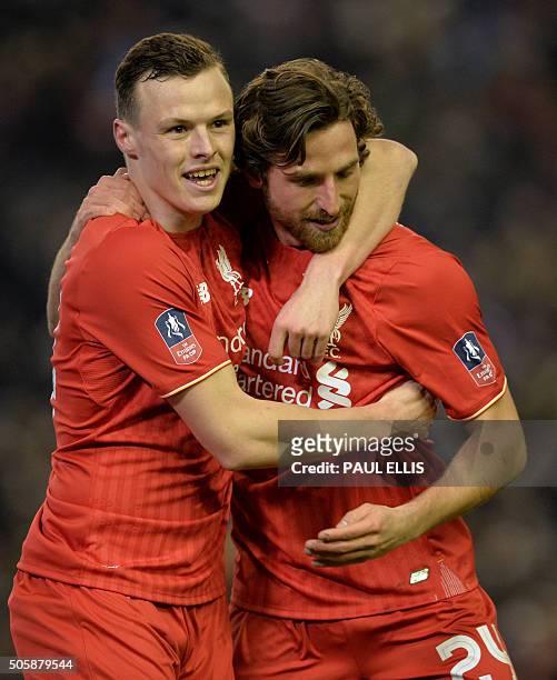 Liverpool's Welsh midfielder Joe Allen celebrates with Liverpool's Australian defender Brad Smith after scoring the opening goal of the English FA...