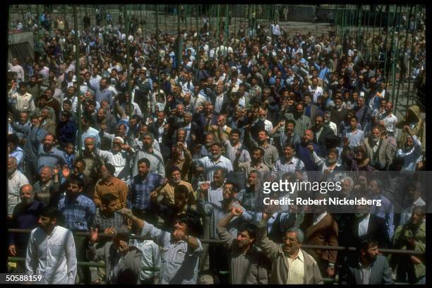 Emoting crowd shouting down w. USA, down w. Israel, attending Fri. Moslem prayer service, held outside.