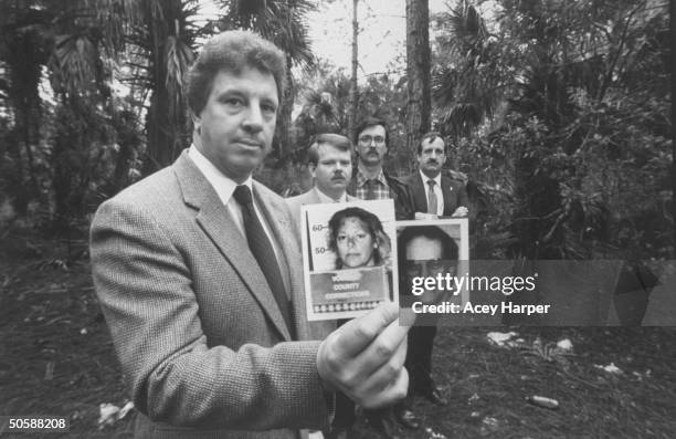 Investigators of lesbian serial murderer Aileen Wuormos , Richard Vogel, Bob Kelley & Larry Horzepa & Jake Erhart; holding mug shots of Aileen...