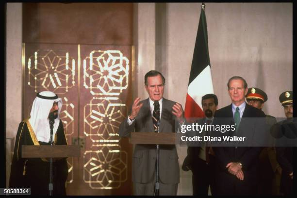 Pres. Bush flanked by State Secy. Baker & Kuwaiti Emir Jaber al-Sabah, speaking, during his Thanksgiving gulf crisis visit w. US troops et al.