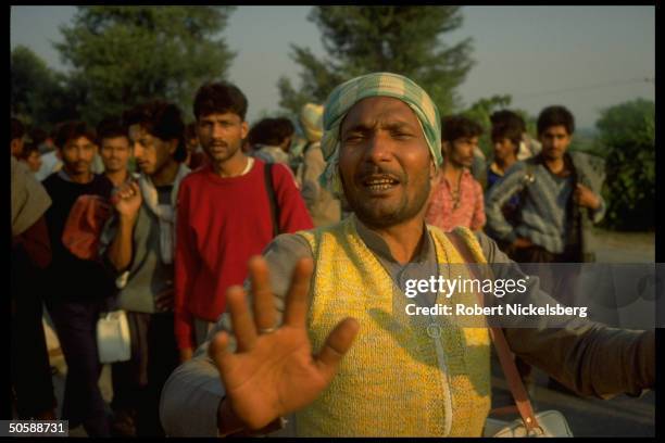 Emoting multitude of militant Hindu activists rioting, re razing Muslim mosque, Babri Masjid, & erecting Hindu temple to god-king Rama.