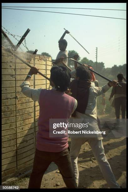 Militant Hindu activists on rampage, rioting, re razing Muslim mosque, Babri Masjid, & erecting Hindu temple to god-king Rama.