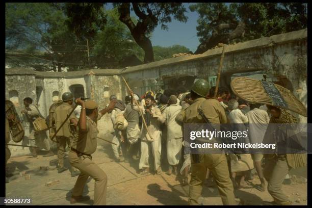 Riot police battling rampaging incited Hindus bent on razing Muslim mosque, Babri Masjid, & erecting Hindu temple to god-king Rama.