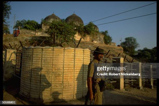 Police guarding fortified post by Babri Masjid against rioting Hindus bent on razing mosque & erecting Hindu temple to god-king Rama.
