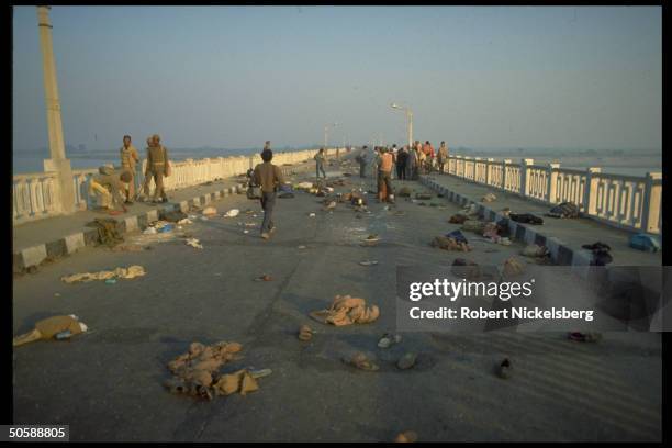 Police on debris-strewn bridge in wake of Hindu rioting re razing mosque, Babri Masjid, & erecting Hindu temple to god-king Rama.