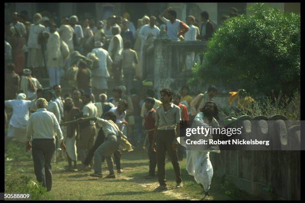 Militant Hindus on rampage, rioting, bent on razing Muslim mosque, Babri Masjid, & erecting Hindu temple to god-king Rama.