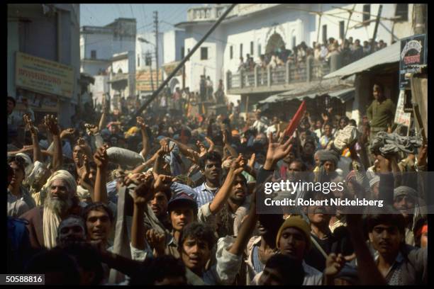 Emoting crowd in streets during Hindu activist rioting, re razing Muslim mosque, Babri Masjid, & erecting Hindu temple to god-king Rama.