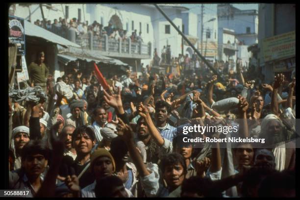 Emoting crowd in streets during Hindu activist rioting, re razing Muslim mosque, Babri Masjid, & erecting Hindu temple to god-king Rama.