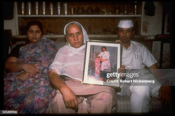 Family with picture of Monica Chadha a higher caste student who self-immolated in protest of Mandal Committee plan for government job quotas for...