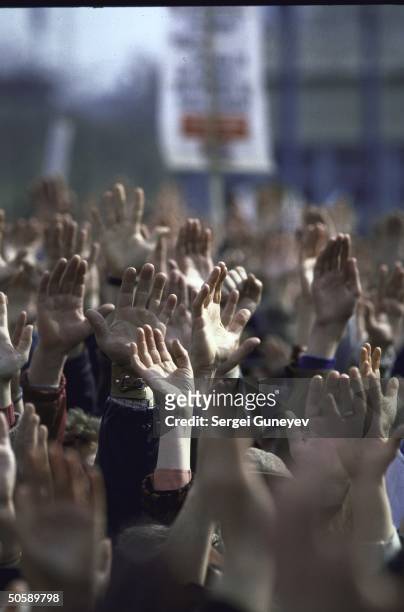Sea of hands raised amid crowd of Yeltsin supporters, rallying for reform-minded, opposition maverick, at Luzhniki stadium election event.