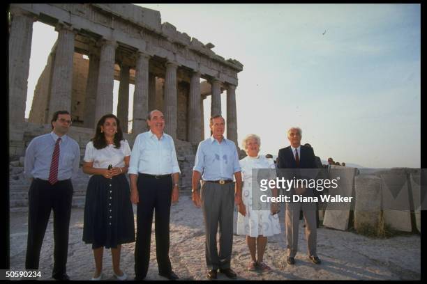 Pres. & Barbara Bush w. PM Mitsotakis & daughter Dep. Min. Dora Bakoyianni, For. Min. Samaras & Dr. Kalligas, by Parthenon, touring Acropolis.