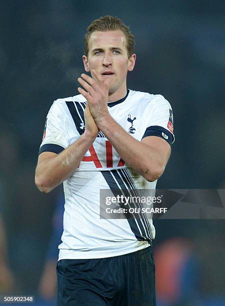 Tottenham Hotspur's English striker Harry Kane applauds supporters at the final whistle in the English FA Cup third round replay football match...