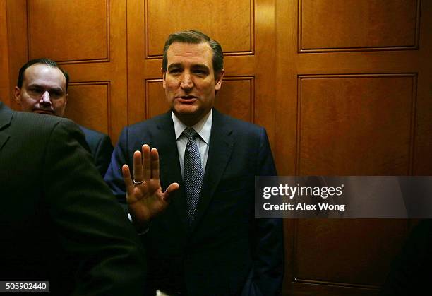 Republican presidential candidate Sen. Ted Cruz refuses to answer questions from the meida as he leaves with Sen. Mike Lee after a vote January 20,...