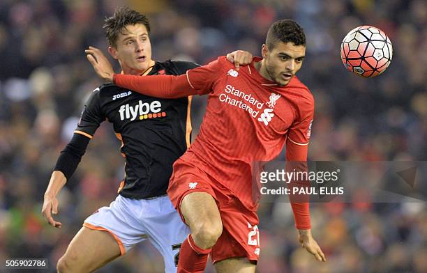 Exeter City's English striker Tom Nichols vies with Liverpool's Portuguese defender Tiago Ilori during the English FA Cup third round replay football...