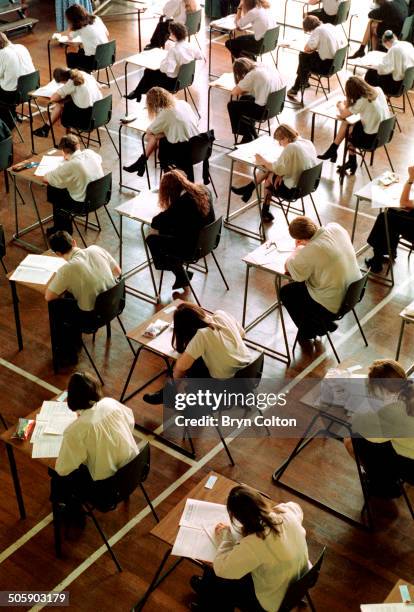 School students from year 11 at Northgate High School sit and take there GCSE English exams while working at temporary desks in the main hall of the...