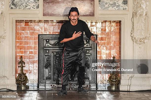 Haider Ackermann acknoledges the applause of the public after the Haider Ackermann Menswear Fall/Winter 2016-2017 show as part of Paris Fashion Week...