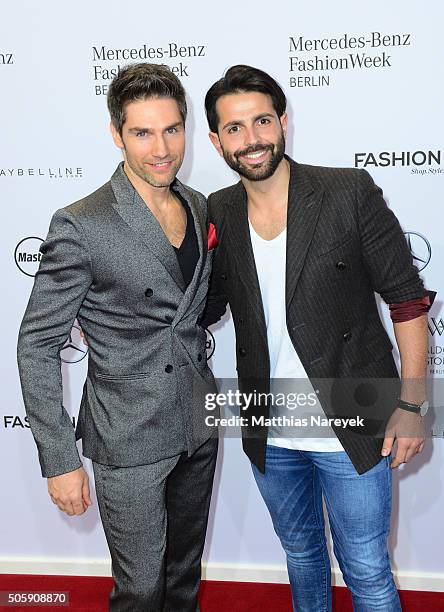 Christian Polanc and Serhat Yilmaz attend the Guido Maria Kretschmer show during the Mercedes-Benz Fashion Week Berlin Autumn/Winter 2016 at...