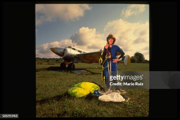 Financial analyst & amateur sky diver Jill Shields, re survival of 4,000 ft. Free-fall after parachute failure during jump, posing w. Gear at...