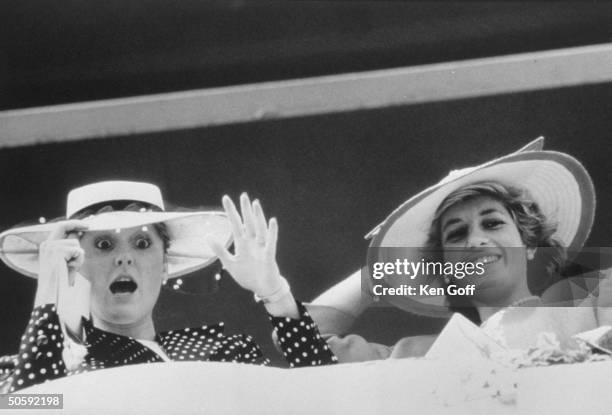 England's Princess Diana w. Sister-in-law Sarah, Duchess of York, both wearing large hats at Epsom Downs.