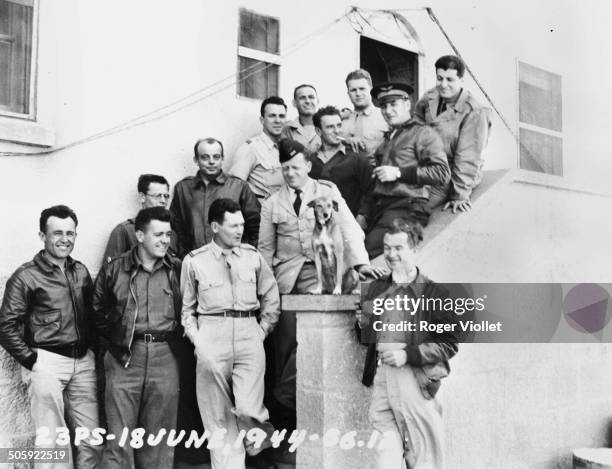 French writer and aviator Antoine de Saint Exupéry , with a group of US Air Force personnel, 18th June 1944. Saint Exupéry disappeared over the...