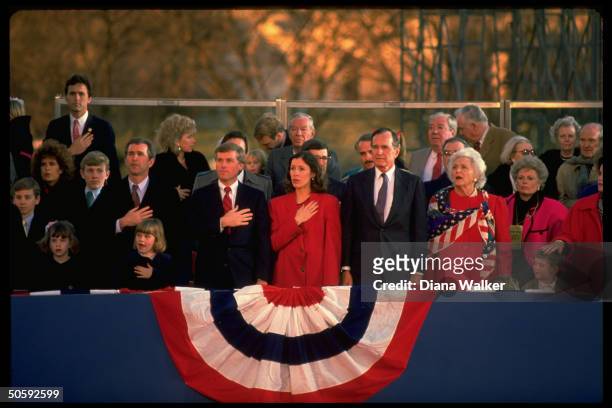 Pres. & Barbara Bush in inaugural stands, w. VP & Marilyn Quayle , Bush progeny incl. Sons George , Marvin & their families.