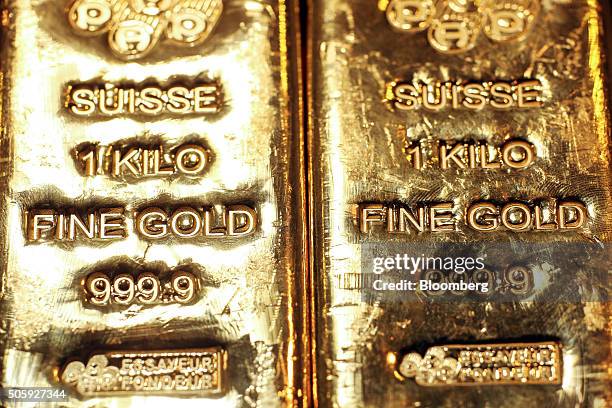 One kilogram gold bars sit in a window display at the YLG Bullion International Co. Headquarters in Bangkok, Thailand, on Wednesday, Jan. 13, 2016....