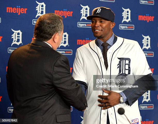 Detroit Tigers Executive Vice President of Baseball Operations and General Manager Al Avila shakes hands with newest Tiger Justin Upton during the...