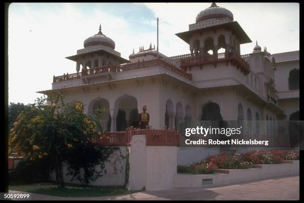 White sandstone Rambagh Palace, 1 of princely Rajput abodes converted to luxury hotel.
