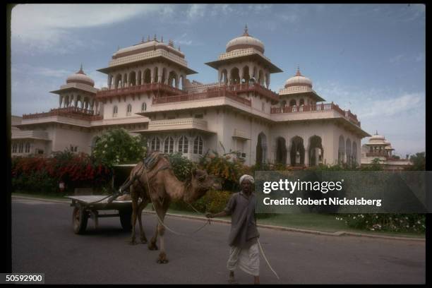 White sandstone Rambagh Palace, 1 of princely Rajput abodes converted to luxury hotel.