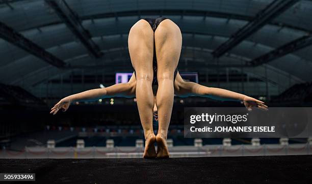 This photo taken on January 20, 2016 in Shanghai shows a member of the Chinese national Diving team jumping of the 10m platform during a training...