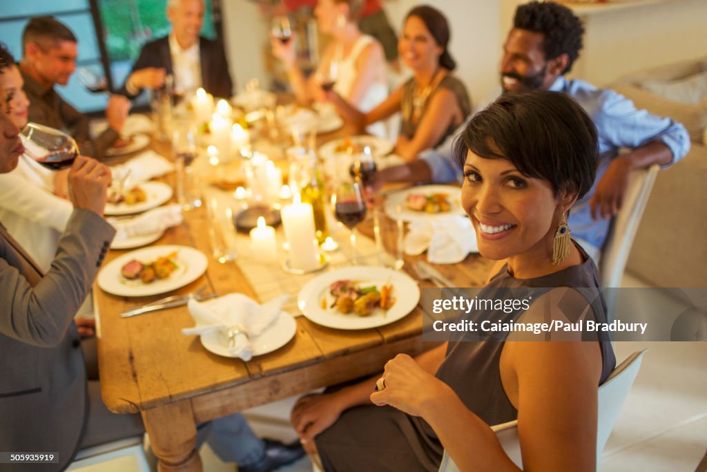 Woman smiling at dinner party