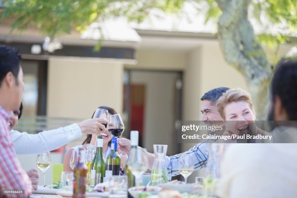 Friends toasting each other at party