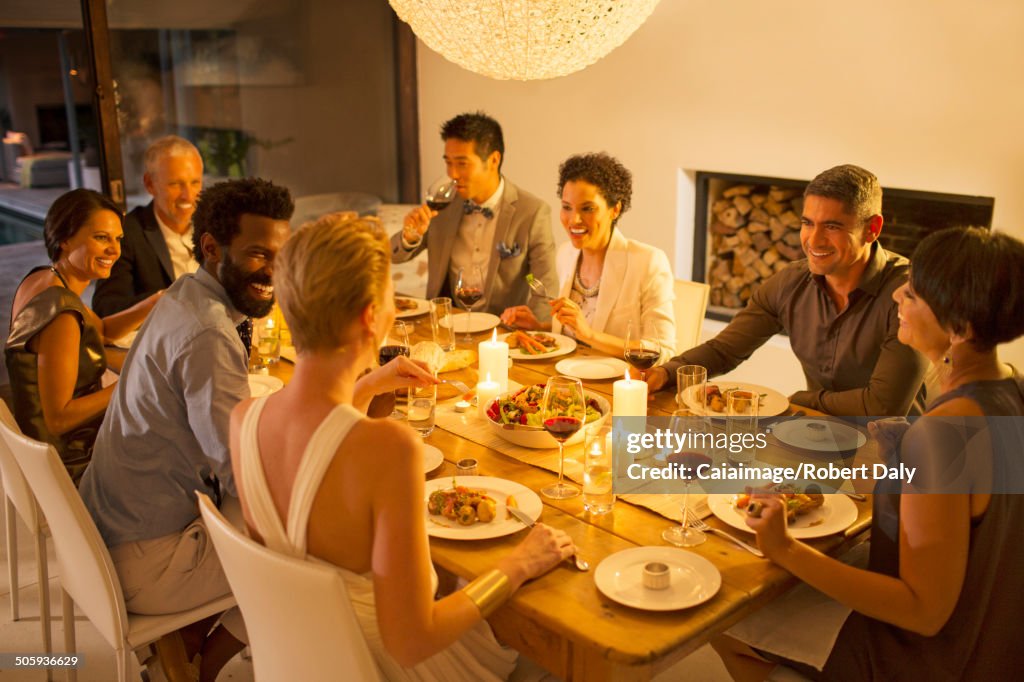Friends talking at dinner party