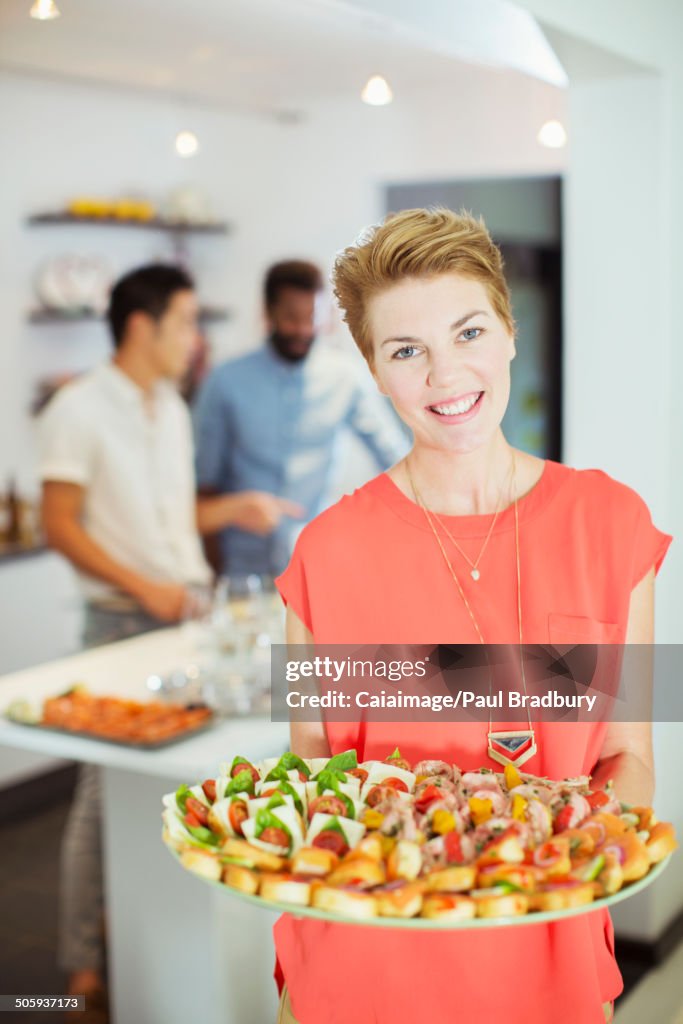 Woman serving food at party