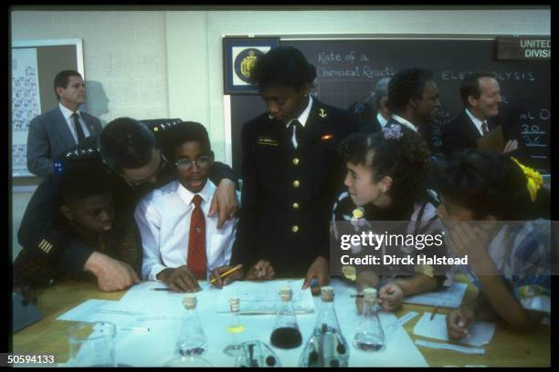 Gen. Colin Powell & Education Secy. Alexander visiting Naval Academy Points of Light award-winning educa- tional program science class.