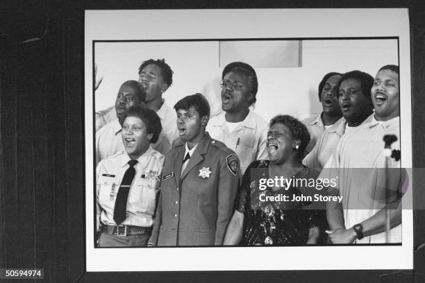 San Quentin Mass Choir performing song in the prison chapel; the choir is made up of male prisoners & 18 female staffers, including prison guards;...