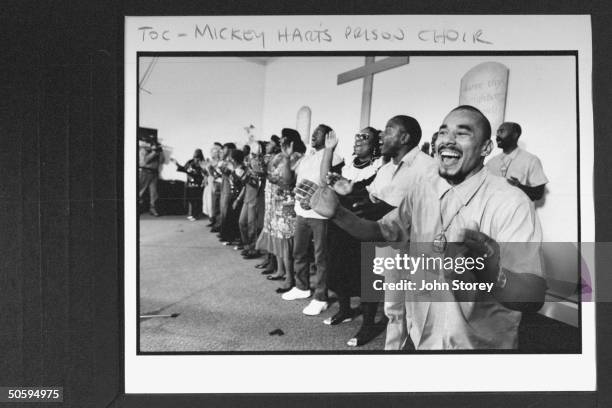 San Quentin Mass Choir performing song in the prison chapel; the choir is made up of male prisoners & 18 female staffers, including prison guards;...